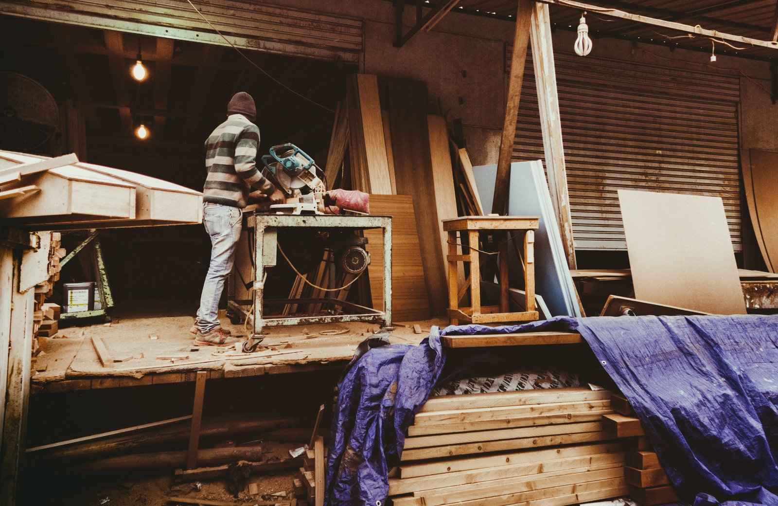 Hands working a timber project in the Men's Shed workshop